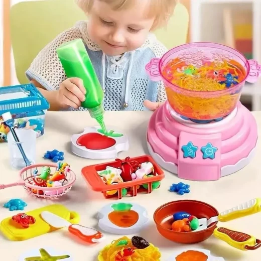 Magic Kitchen or "Magic Water Kitchen," is a creative toy that allows children to make colorful, three-dimensional jelly shapes using "magic jelly" and various molds - Creative's - Image 2