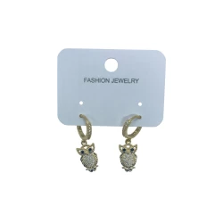 AURA Gold earrings featuring a crystal-studded hoop and a sparkling owl charm with bold black eyes – color guaranteed